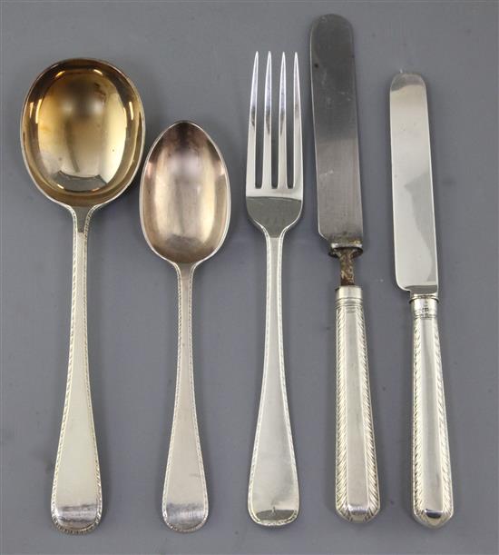 A George V part canteen of silver Old English fancy feather edge pattern cutlery by Mappin & Webb, weighable silver 139 oz.